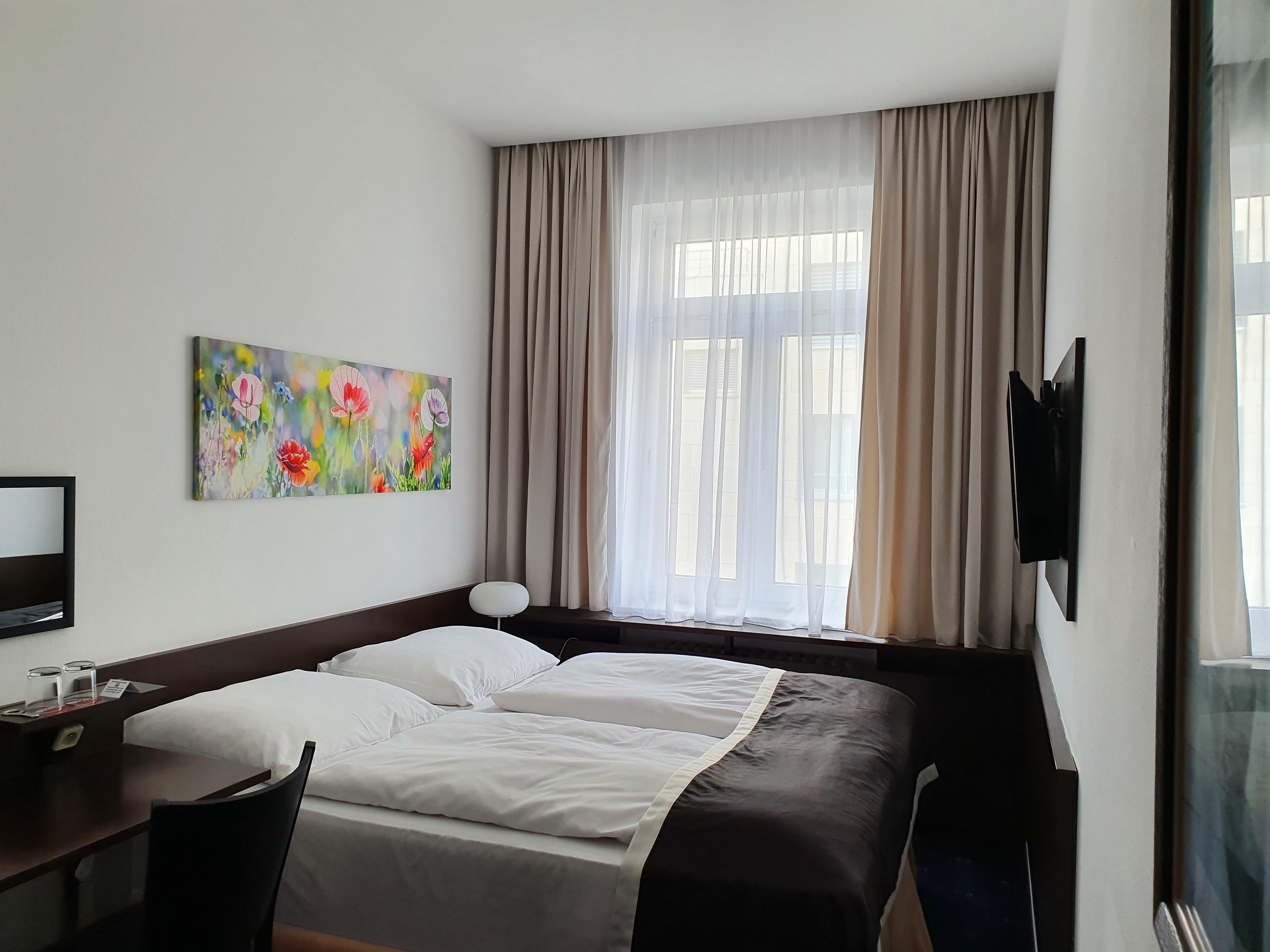 Doppel- oder Zweibettzimmer